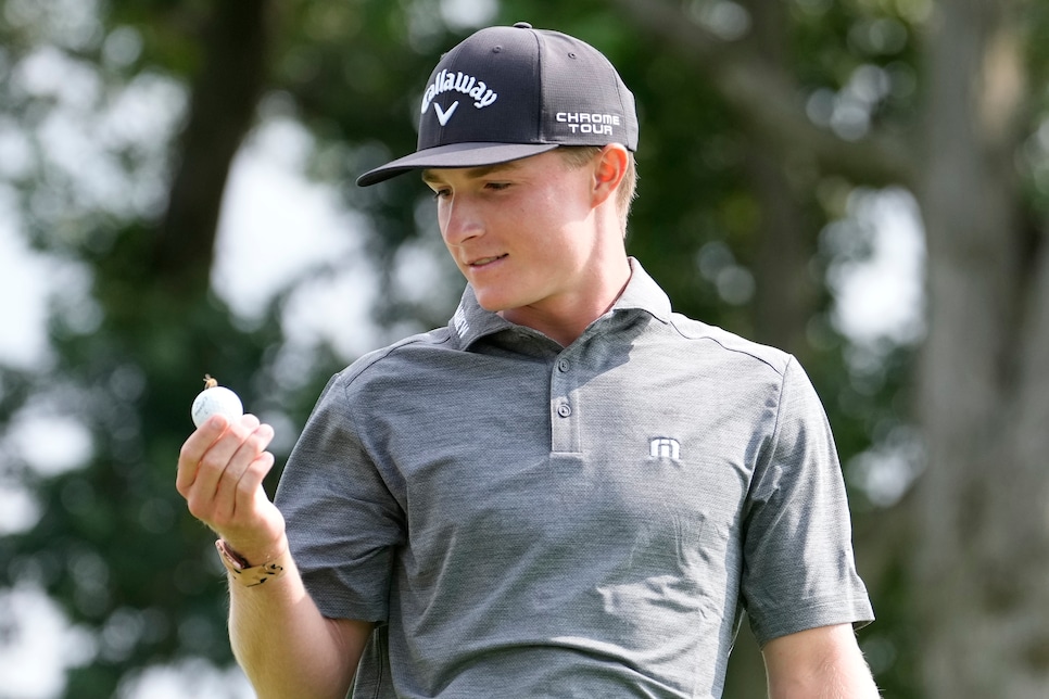 2163522944 BLOOMFIELD HILLS, MICHIGAN - JULY 24: Blades Brown of the United States looks at a bee on his ball on the 13th tee during day three of the 76th U.S. Junior Amateur Championship on the South Course at Oakland Hills Country Club on July 24, 2024 in Bloomfield Hills, Michigan. (Photo by Raj Mehta/Getty Images)