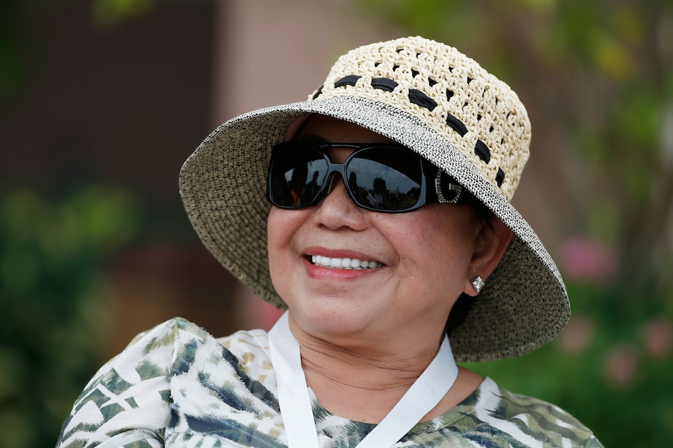 459887900 WINDERMERE, FL - DECEMBER 03: Kultida Woods waits near the clubhouse as her son Tiger Woods plays during the pro-am prior to the start of the Hero World Challenge at the Isleworth Golf & Country Club on December 3, 2014 in Windermere, Florida. (Photo by Scott Halleran/Getty Images)